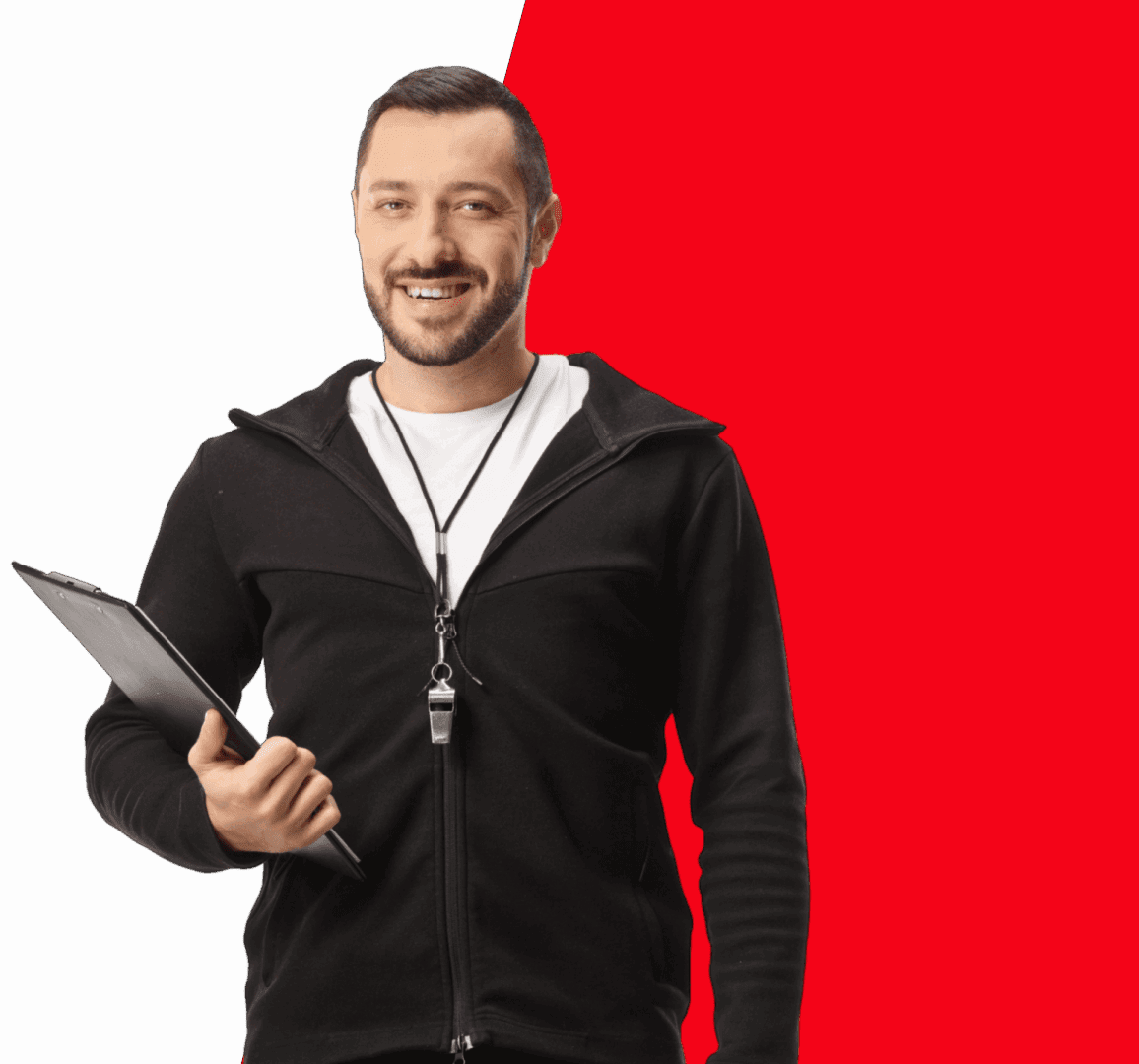 Smiling man with clipboard and whistle.